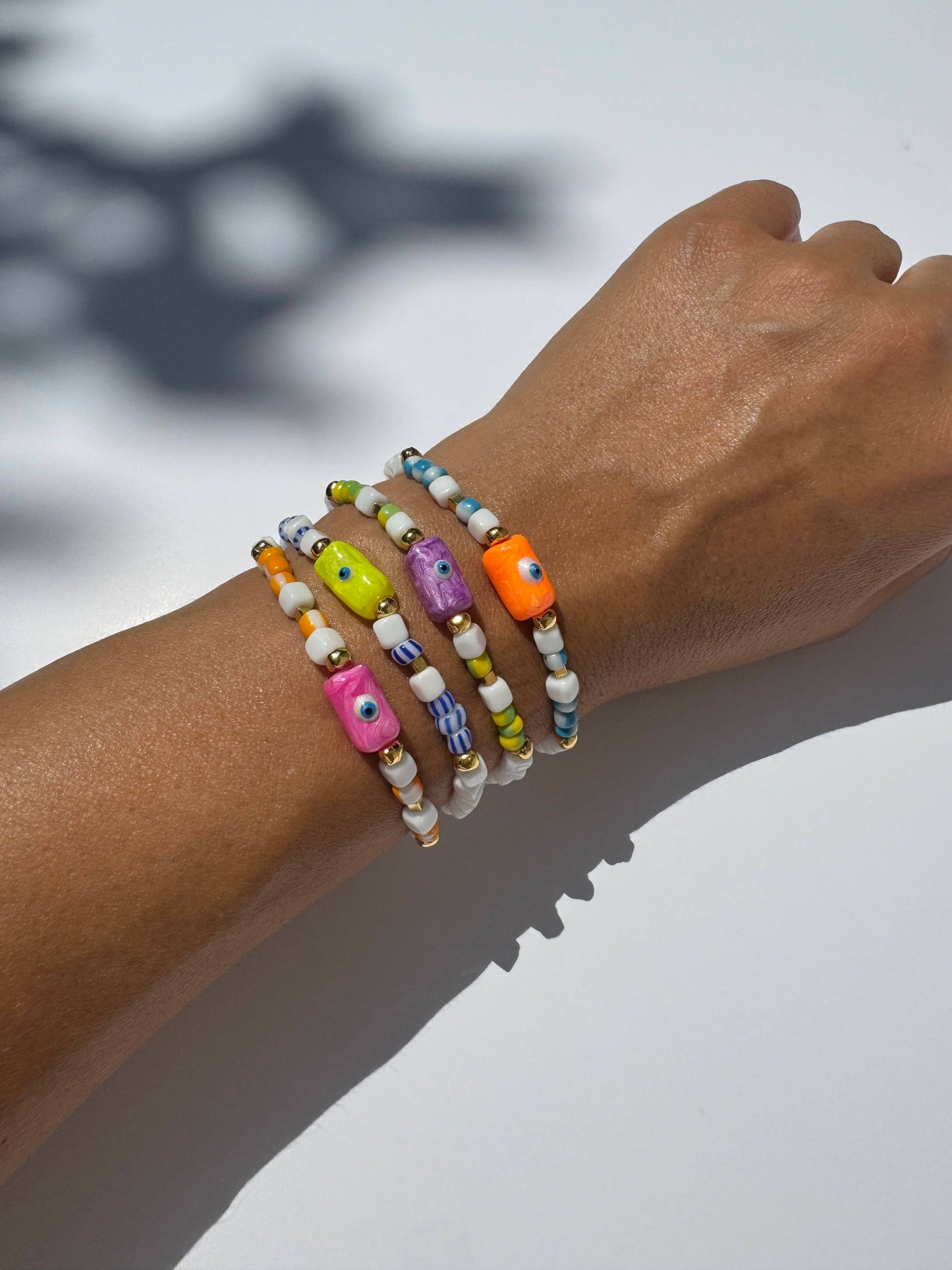 Pink Evil Eye Bracelet (glass beads, acrylic evil eye, & metal beads)